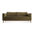 Guide 82" Sofa in moss velvet with plush cushions, wide armrests, and a walnut base, shown from the front against a white background.