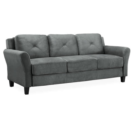 The iLounge Harvard Microfiber Sofa, featuring a gray finish and plush cushions for seating three, showcases rounded armrests and stands on short, dark wooden legs. Its upholstery includes subtle button tufting on the backs of the cushions and is set against a plain white background.