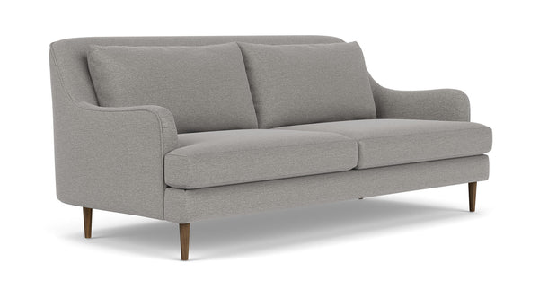 Introducing the Kaydan Sofa, a contemporary piece in a stylish gray hue featuring two seat cushions, two back cushions, and elegantly curved armrests. It boasts sleek wooden legs and a clean, minimalist design.
