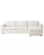 The Conover Sleeper Chaise Sectional is a light beige sofa featuring three cushions and a right-side chaise. It is designed with wide armrests and short wooden legs, showcased against a plain white background.