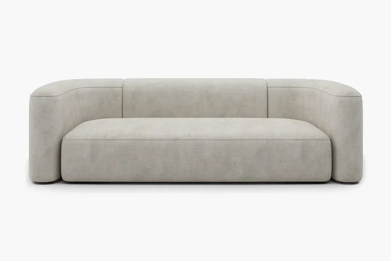 Introducing the Mellow Sectional Sofa by Acanva, a modern piece with a minimalist design featuring light gray, smooth fabric. This sofa boasts a low backrest and rounded armrests, offering a sleek and contemporary aesthetic. It is elegantly displayed against a plain white background.