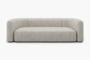 Introducing the Mellow Sectional Sofa by Acanva, a modern piece with a minimalist design featuring light gray, smooth fabric. This sofa boasts a low backrest and rounded armrests, offering a sleek and contemporary aesthetic. It is elegantly displayed against a plain white background.