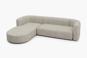 Introducing the Mellow Sectional Sofa by Acanva: a contemporary L-shaped beige sofa with rounded edges, designed with a left-facing chaise and cushioned backrests, elegantly displayed against a plain white background.