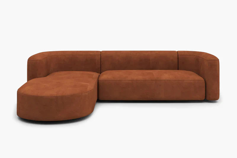 The Mellow Sectional Sofa by Acanva is a contemporary brown piece with a left-facing chaise lounge, showcased against a white backdrop. Its design boasts smooth, rounded edges and plush cushions for added comfort.