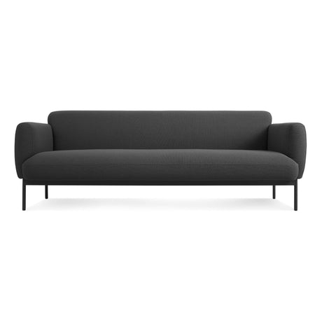 The Puff Puff 87" Sofa, Maharam Meld in Panda, features a modern minimalist design with a dark gray finish, rounded armrests, low backrest, and slim black metal legs—shown here against a plain white background.