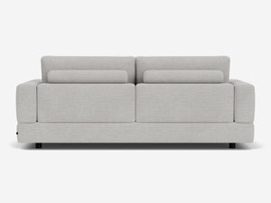 The Stage Track Sofa features a modern, light gray design with a minimalist aesthetic. It has a rectangular shape, two attached back cushions, and short black legs. The upholstery is soft and textured, making it an excellent addition to any contemporary living space.