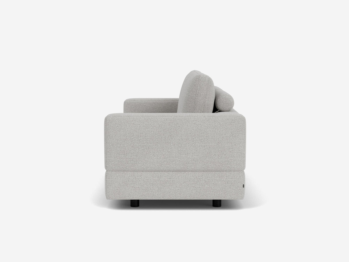 Side view of the Stage Track Sofa, a modern light gray upholstered piece featuring straight arms and cushions. The minimalist design rests on small black legs, set against a plain white background.