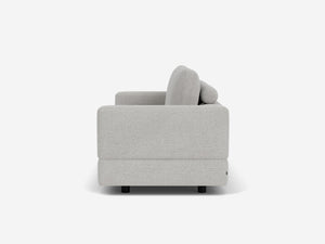 Side view of the Stage Track Sofa, a modern light gray upholstered piece featuring straight arms and cushions. The minimalist design rests on small black legs, set against a plain white background.