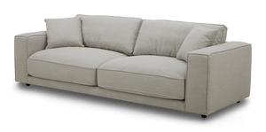 The Elmore Sofa, featuring a contemporary light gray design with plush cushions and wide armrests, is set against a black background.