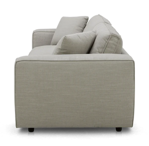 Side view of the Elmore Sofa in light gray fabric, featuring two seat cushions and two back cushions. The modern design rests on low, dark feet.