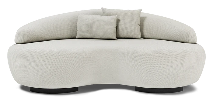 Introducing the Rio Sofa, a stylish, cream-colored piece with a curved silhouette and textured fabric finish. It includes two small matching cushions and a rounded backrest. This sofa boasts a unique wavy design with black base supports, seamlessly combining contemporary style and comfort.