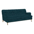 The Maggie Sofa with Brass Nailheads is a dark teal upholstered piece featuring a button-tufted backrest and wooden legs. It boasts two large seat cushions and an elegant design, perfect for enhancing a stylish living room setup.