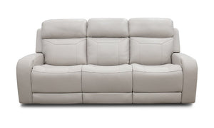 Introducing the Maverick Dove Leather Power Media Sofa: a contemporary, light gray leather reclining sofa featuring three plush cushioned seats. The design boasts sleek lines and a smooth texture, beautifully showcased against a plain white backdrop.
